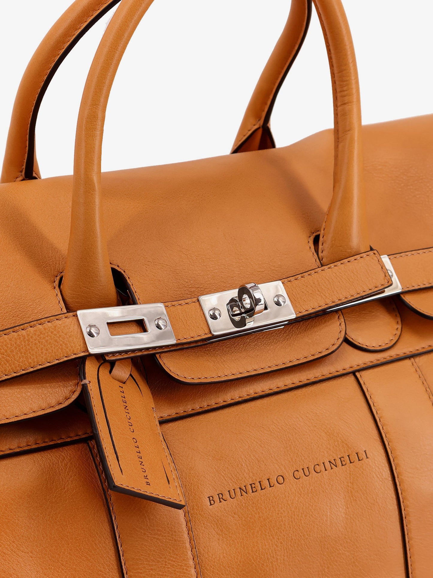 Leather travel bag with engraved logo on the front