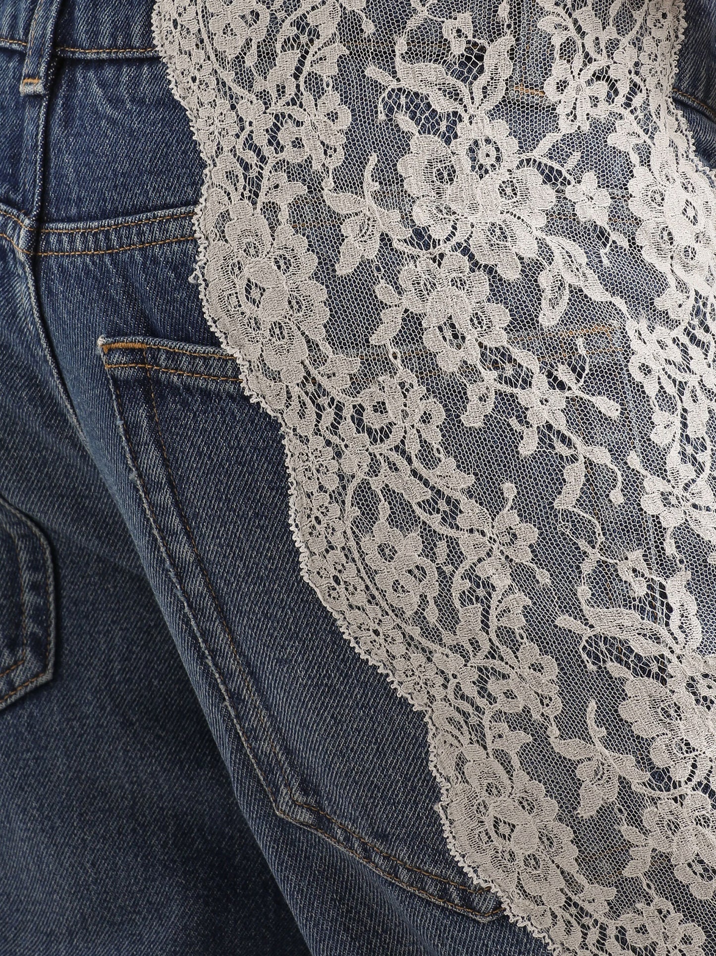 Blue denim jeans with lace profiles