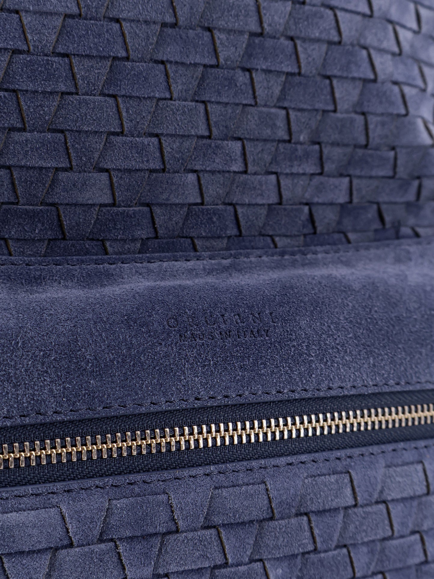 Suede backpack with woven pattern