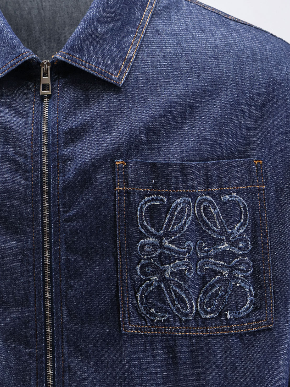 Blue denim jacket with embroidered Anagram logo