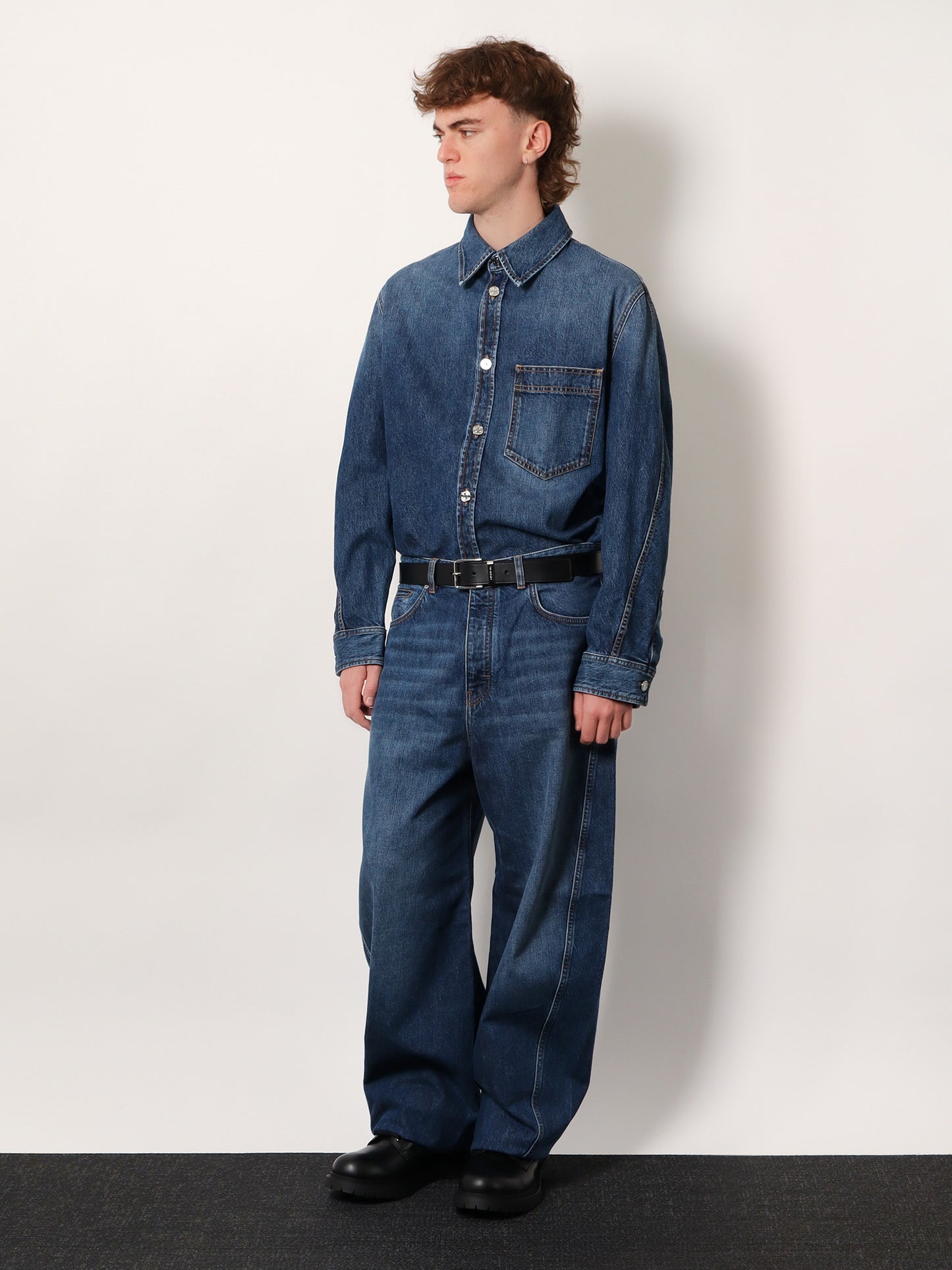 Twisted stone-washed denim jeans