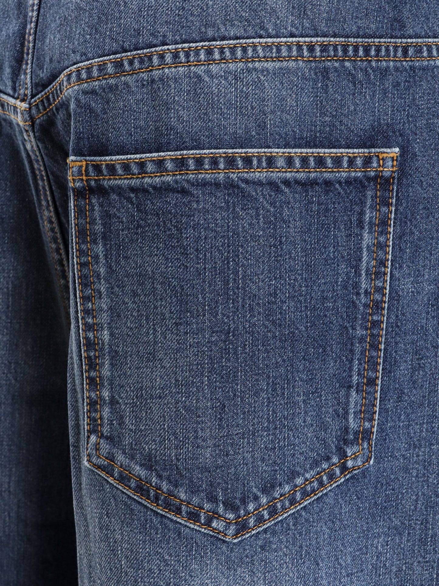 Twisted stone-washed denim jeans