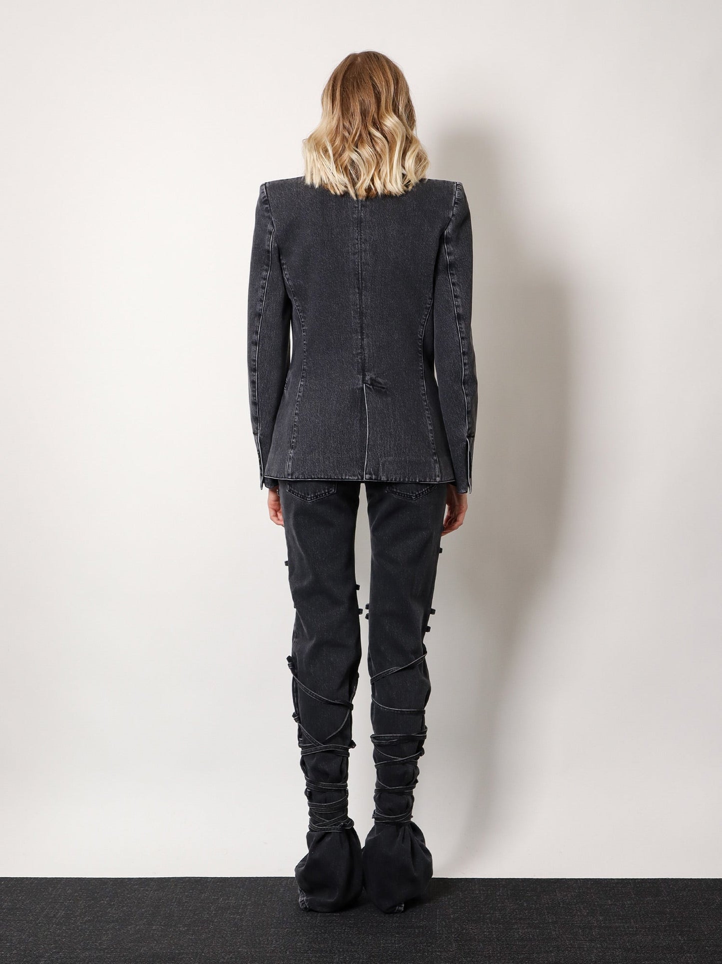 Black denim trousers with knot details