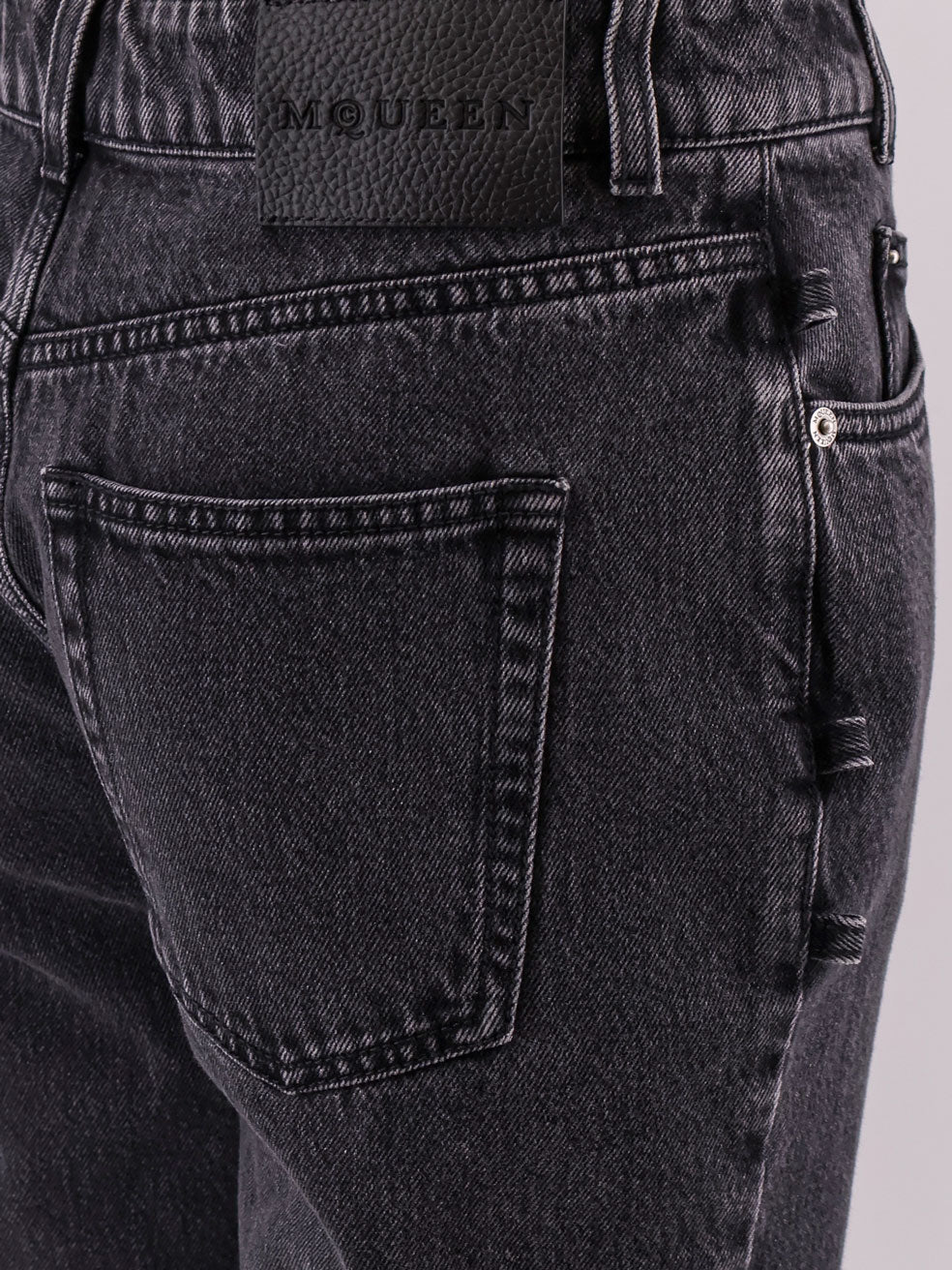 Black denim trousers with knot details