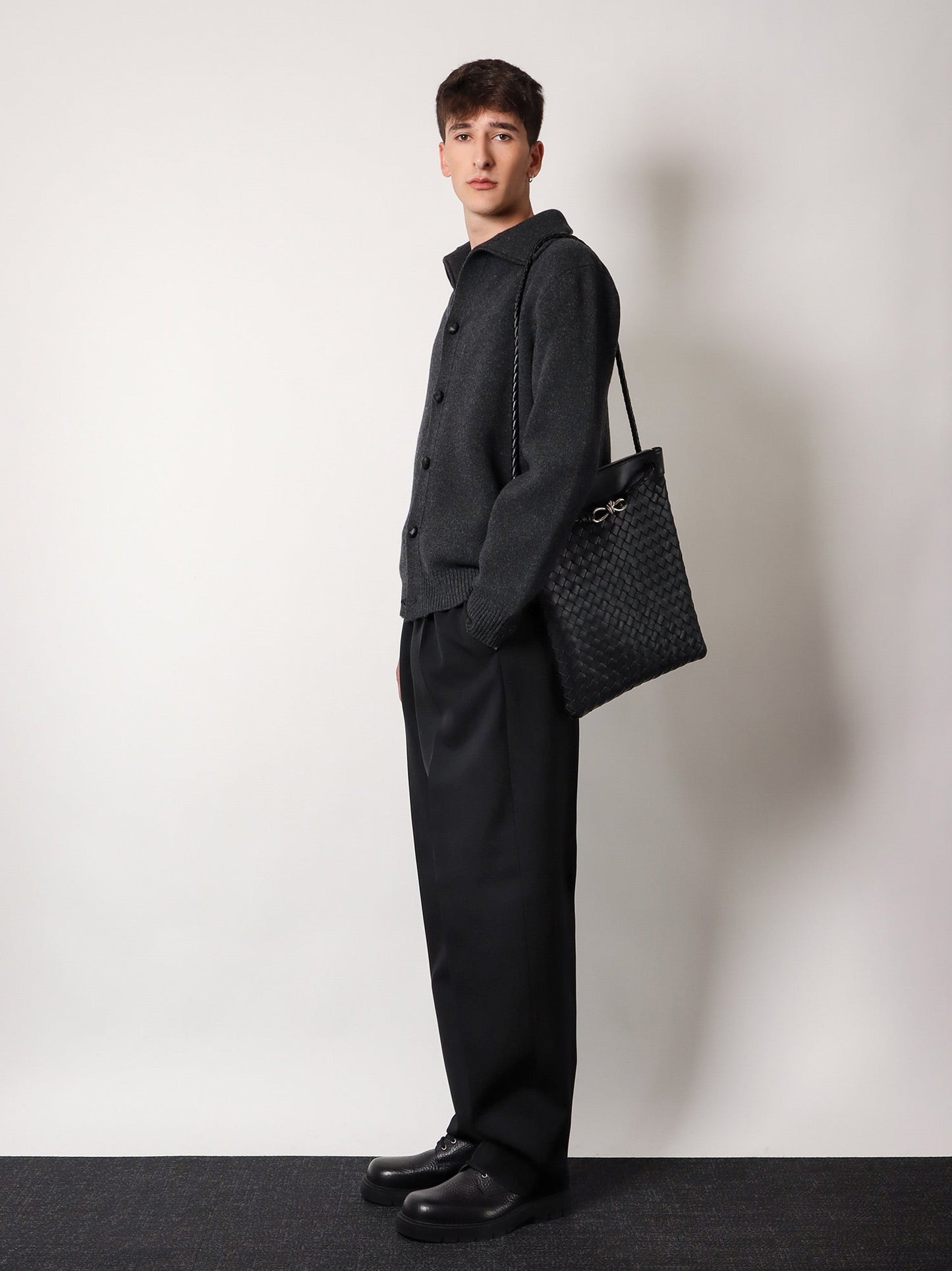 Shoulder bag with woven motif, zip closure and leather shoulder strap with metal knot detail