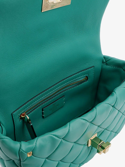 Matelassé leather shoulder bag with iconic studs thumbnail