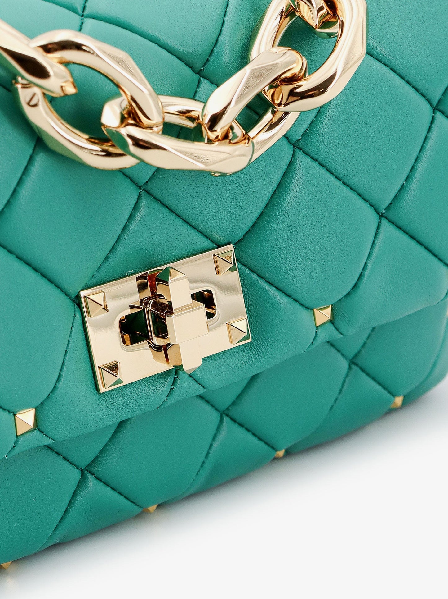 Matelassé leather shoulder bag with iconic studs
