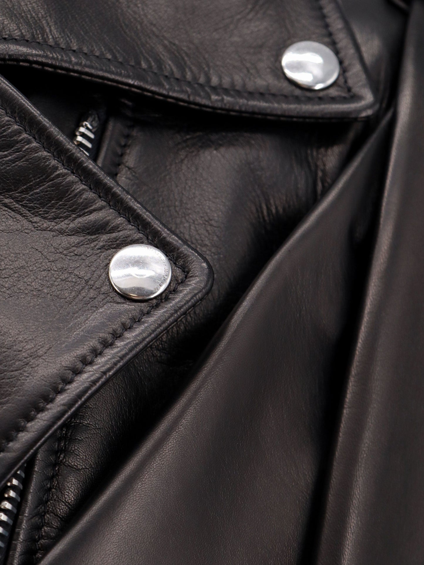 Sleeveless leather jacket with knotted drapery