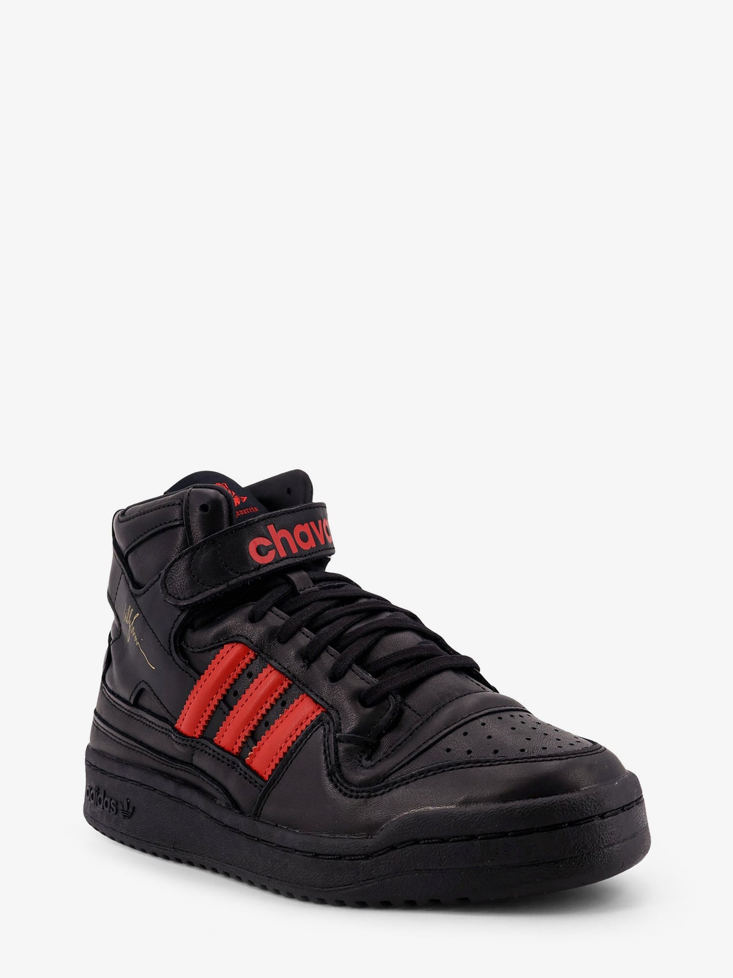 Sneakers in pelle con iconico logo laterale