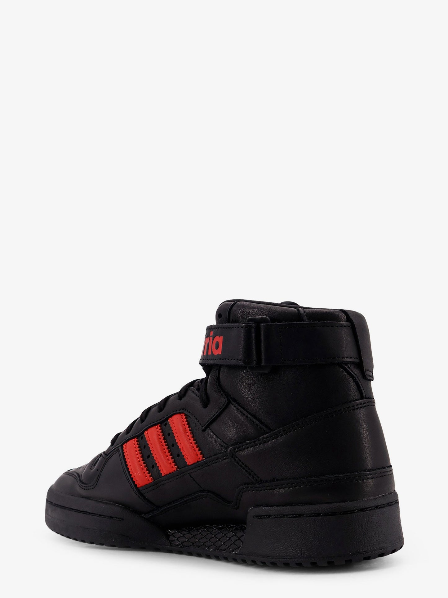 Sneakers in pelle con iconico logo laterale