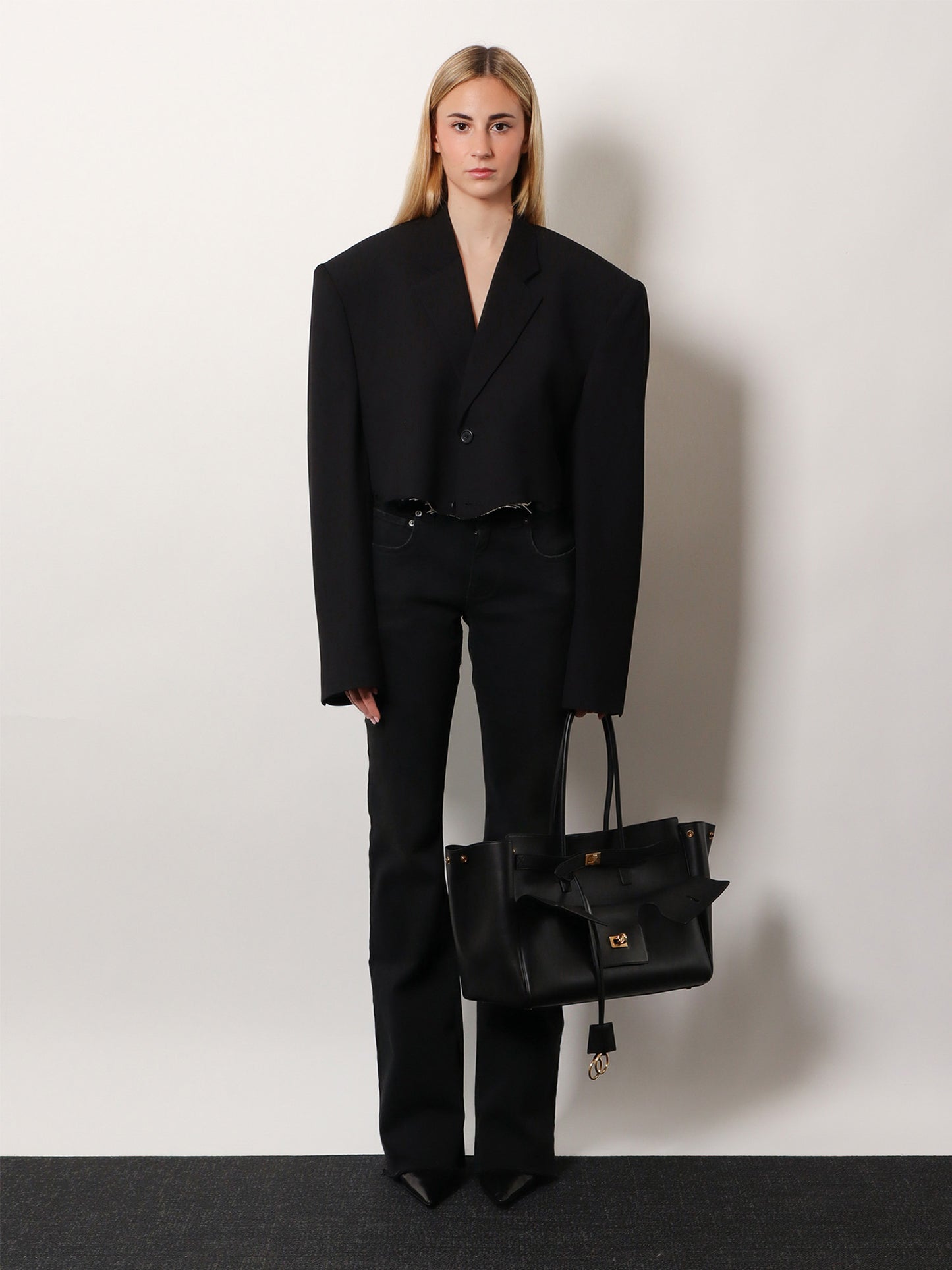 Denim trousers with frayed edges