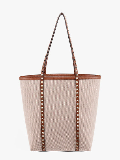 Borsa a tracolla in pelle e canvas con iconiche borchie thumbnail
