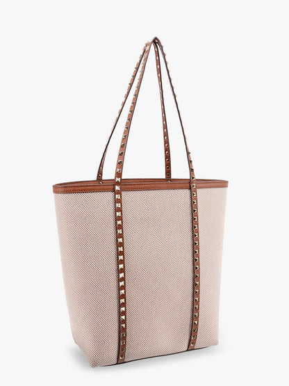 Borsa a tracolla in pelle e canvas con iconiche borchie thumbnail