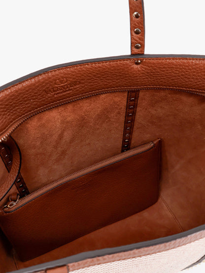 Borsa a tracolla in pelle e canvas con iconiche borchie thumbnail