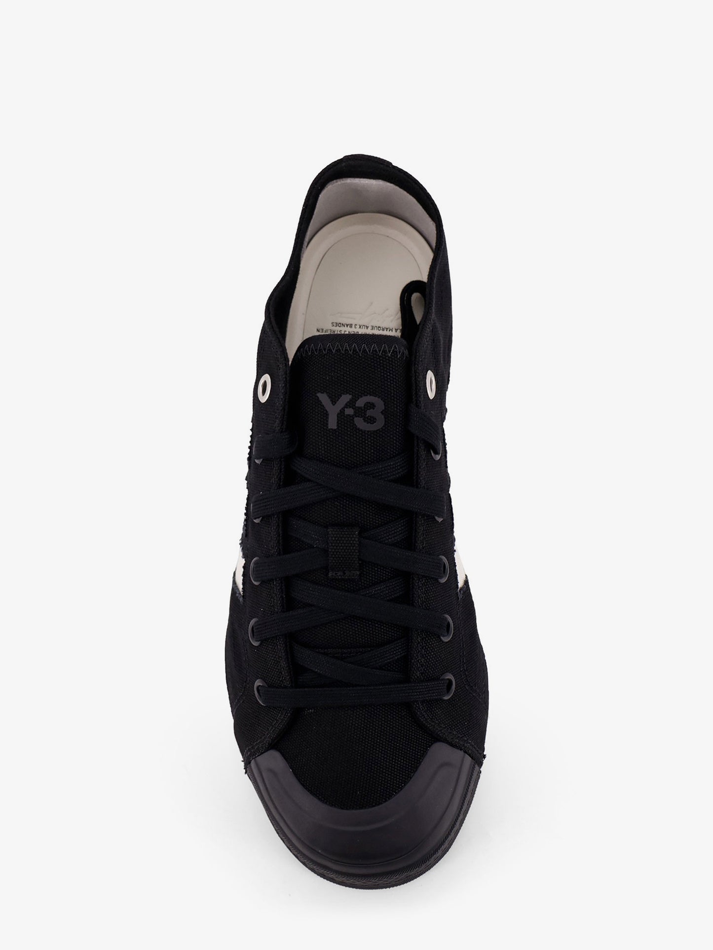Canvas sneakers with logo on the ide