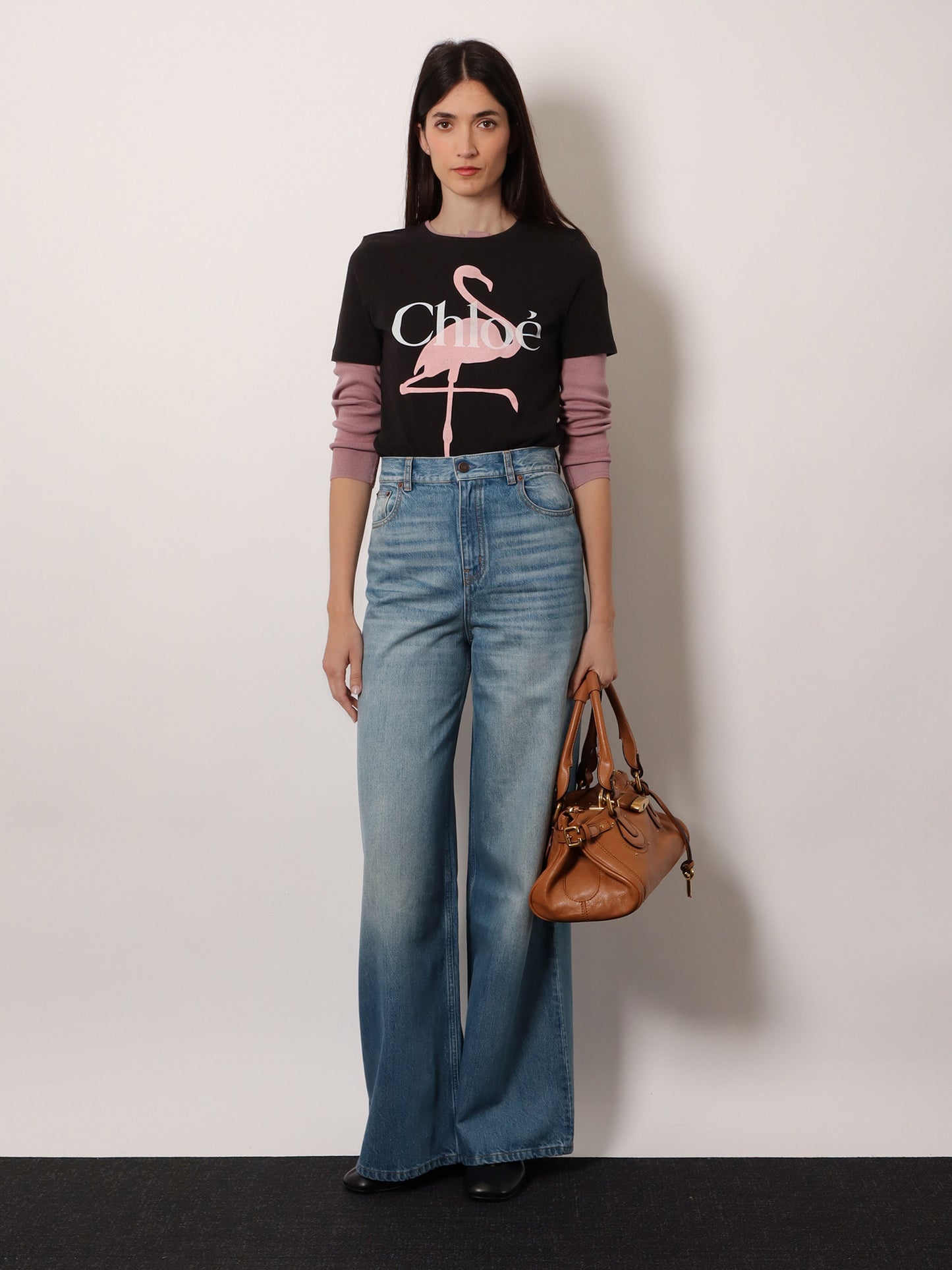 Blue denim jeans with logo label on the back