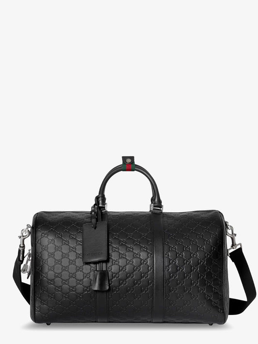Coated canvas GG Emblem travel bag with GG motif