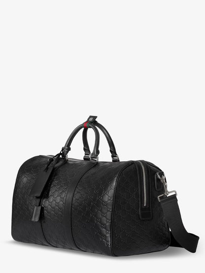 Coated canvas GG Emblem travel bag with GG motif thumbnail