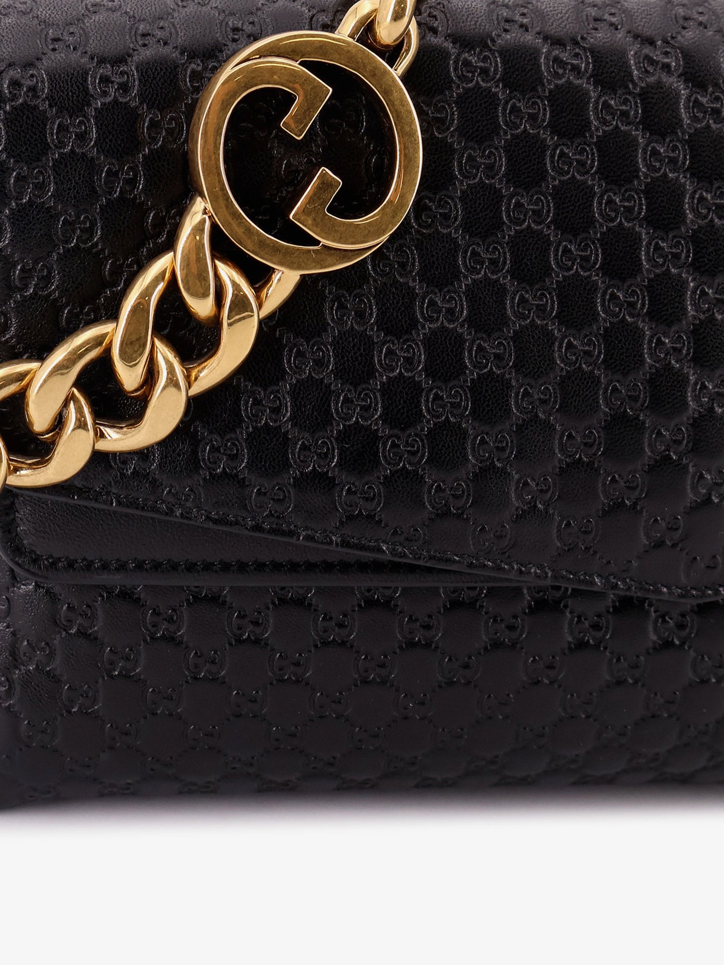 Leather crossbody bag with embossed GG motif