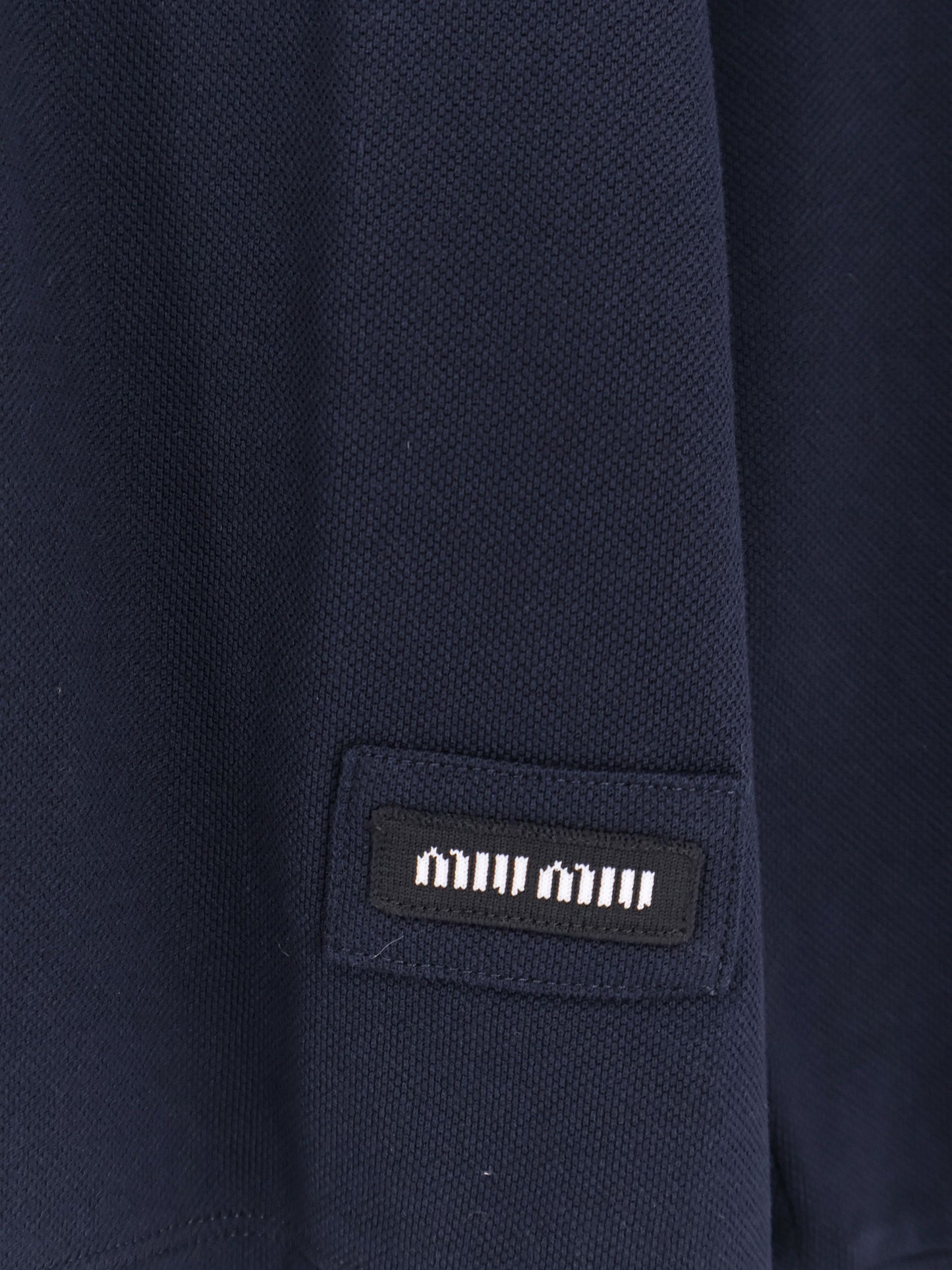 Cotton polo shirt with asymmetric metal zip detail