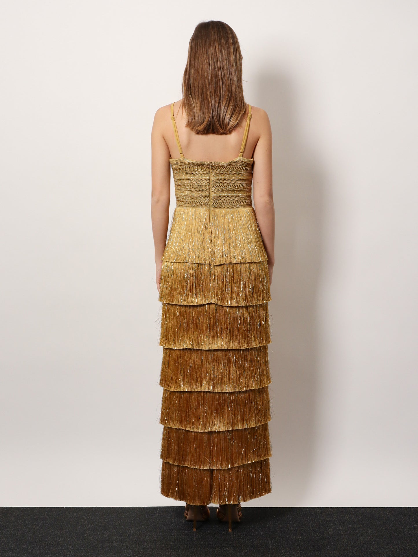 Long dress with embroidered courset and fringes