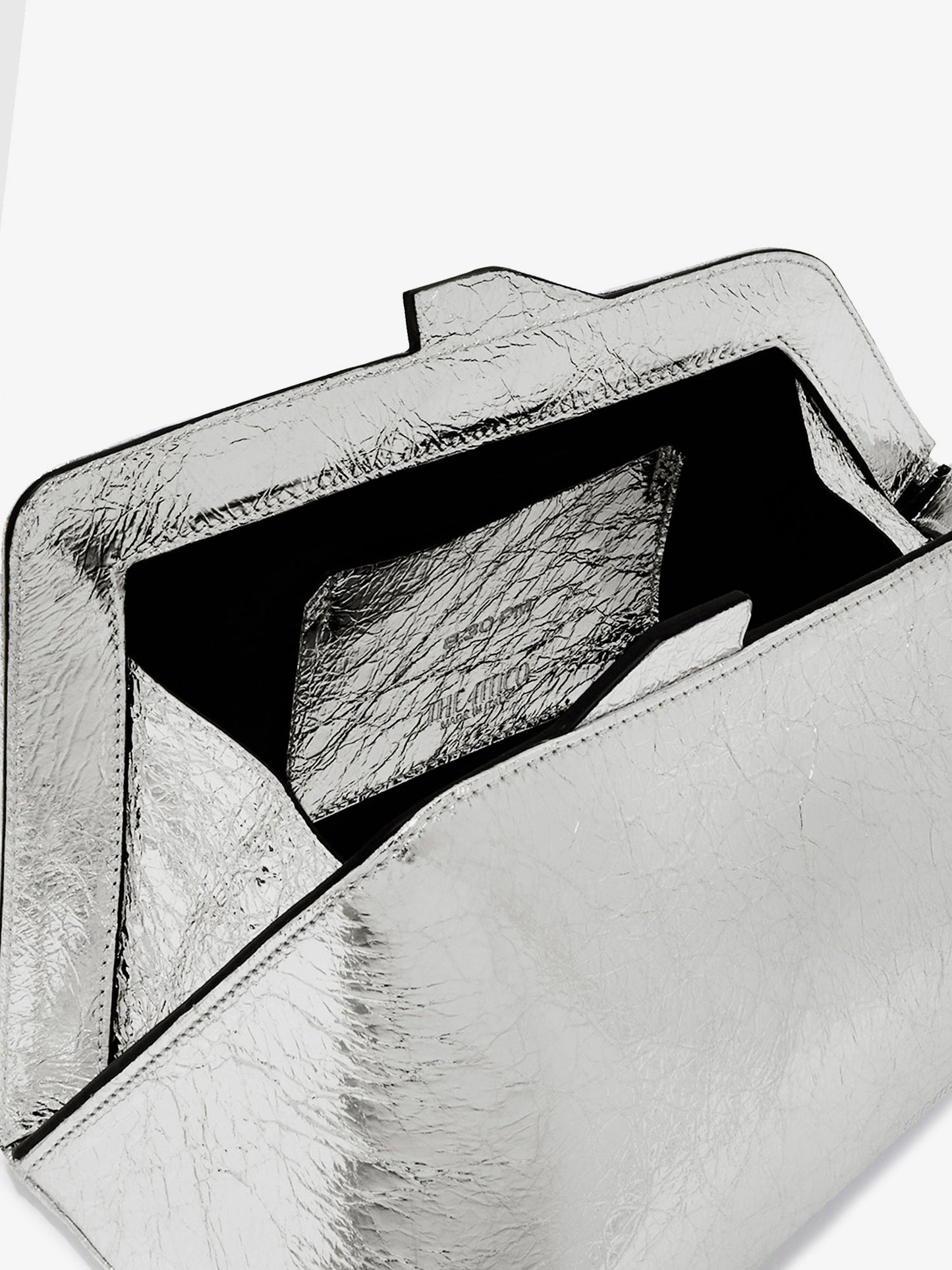 8.30 PM laminated leather clutch bag with logo engraved on the bottom