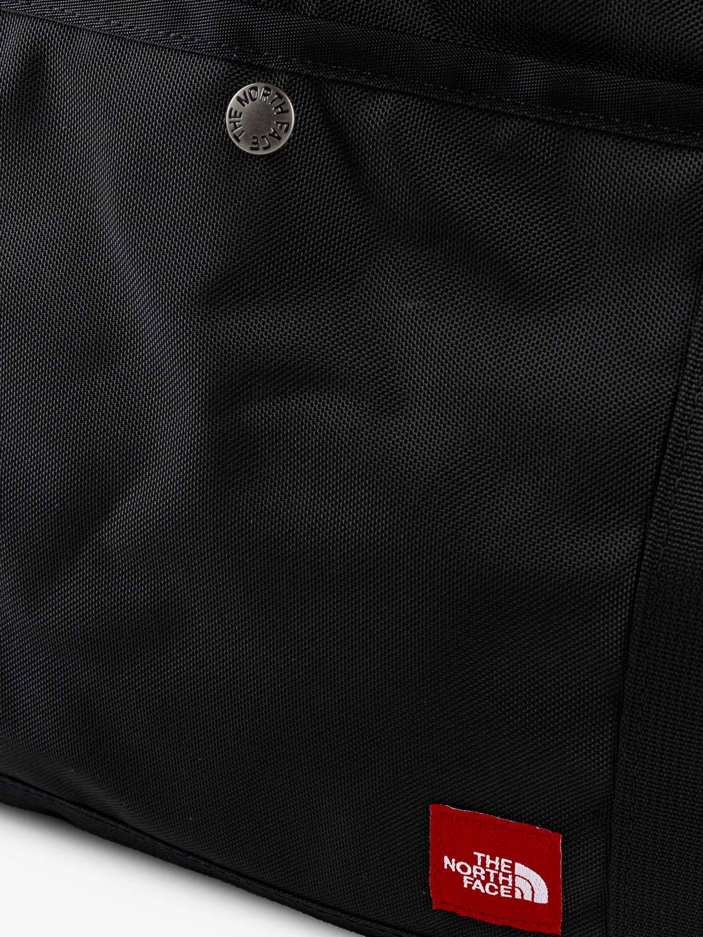 Nylon shoulder bag with logo label on the bottom