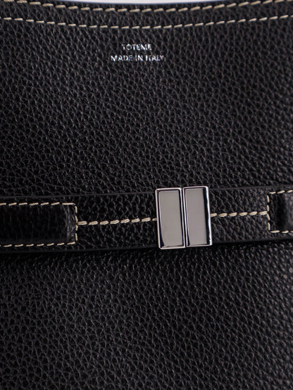 Hammered leather bucket bag with strap on the front thumbnail