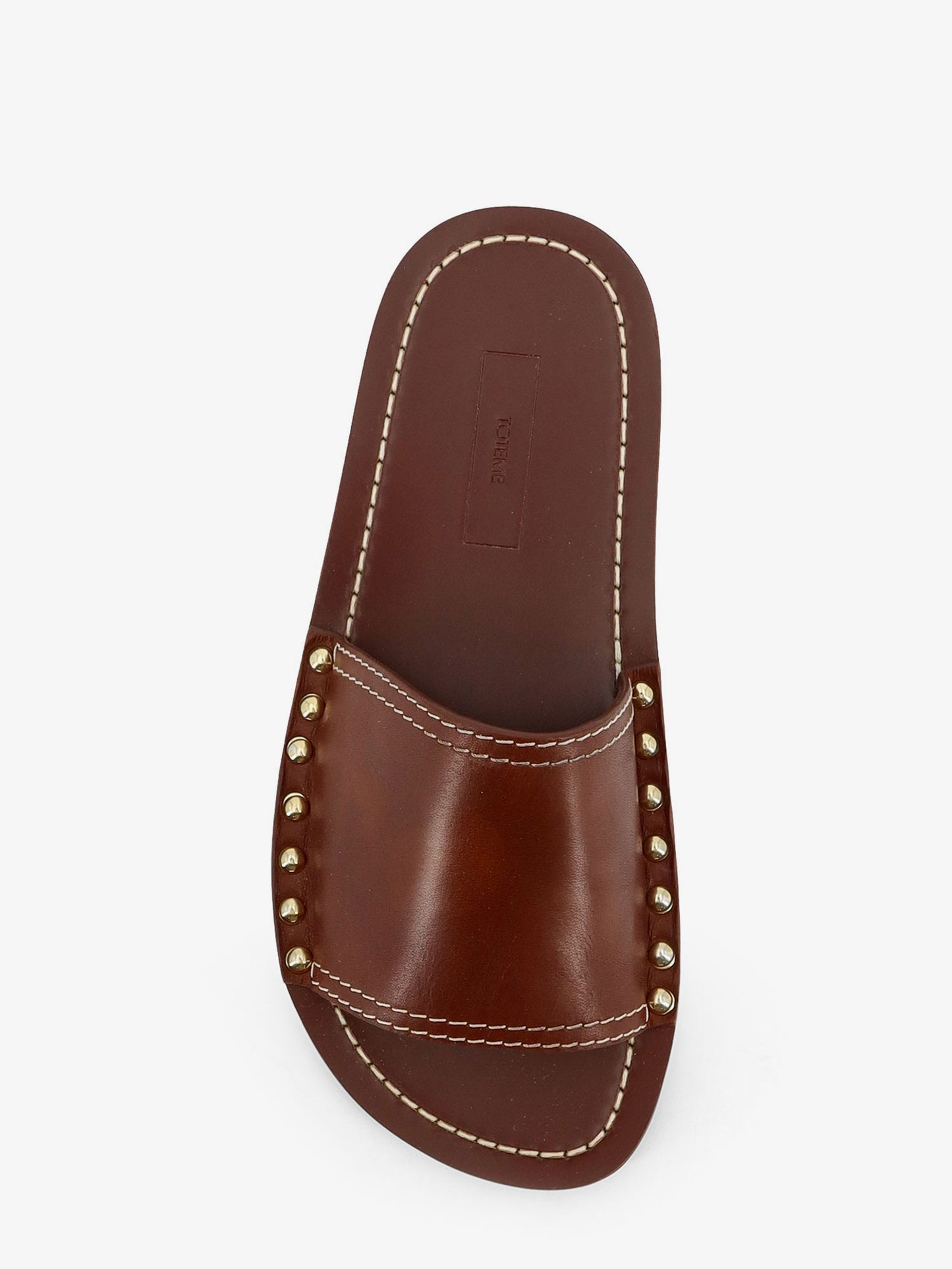 Sandali bassi in pelle con borchie in metallo laterali