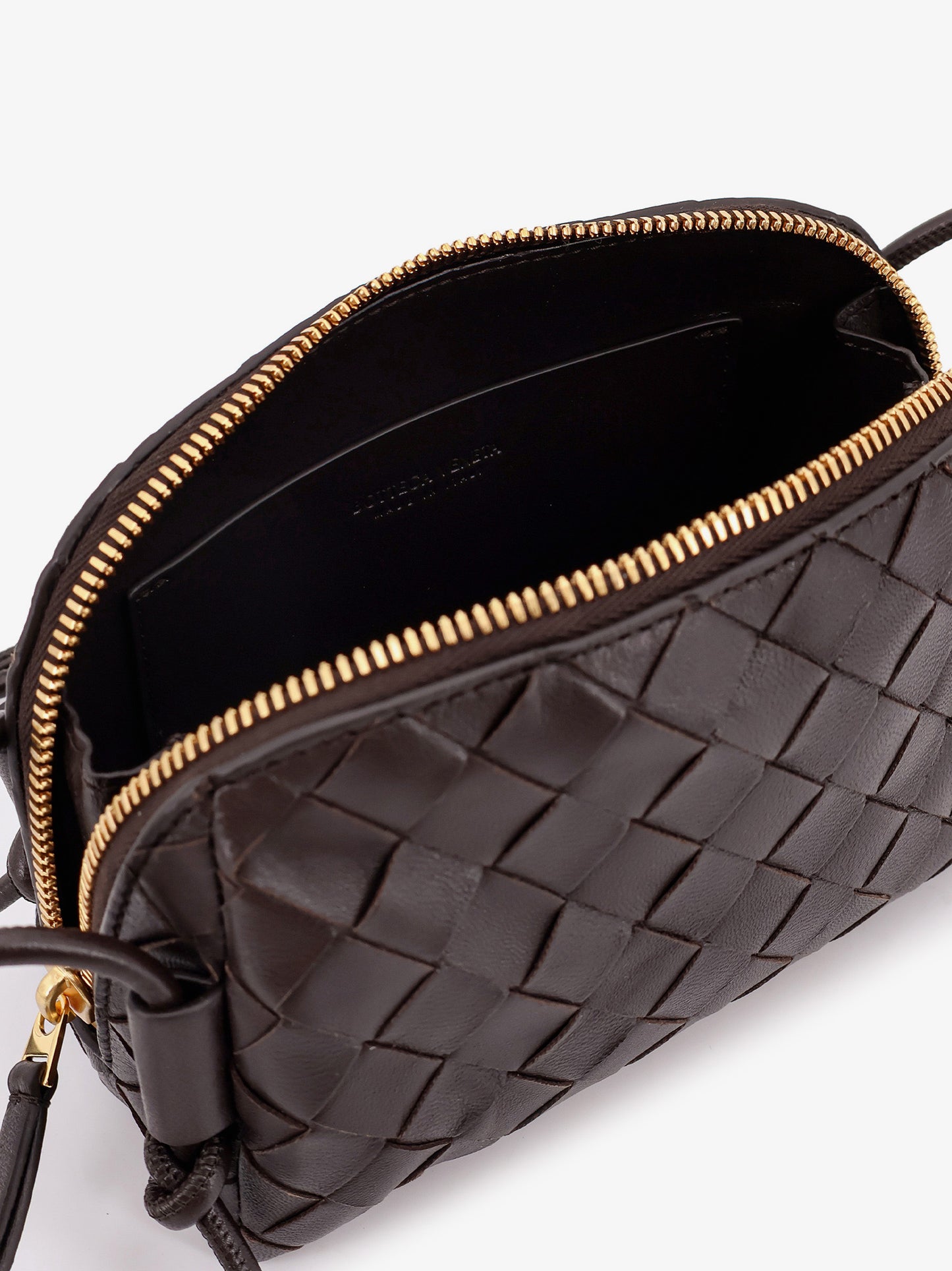 Leather clutch with Intrecciato Concert motif