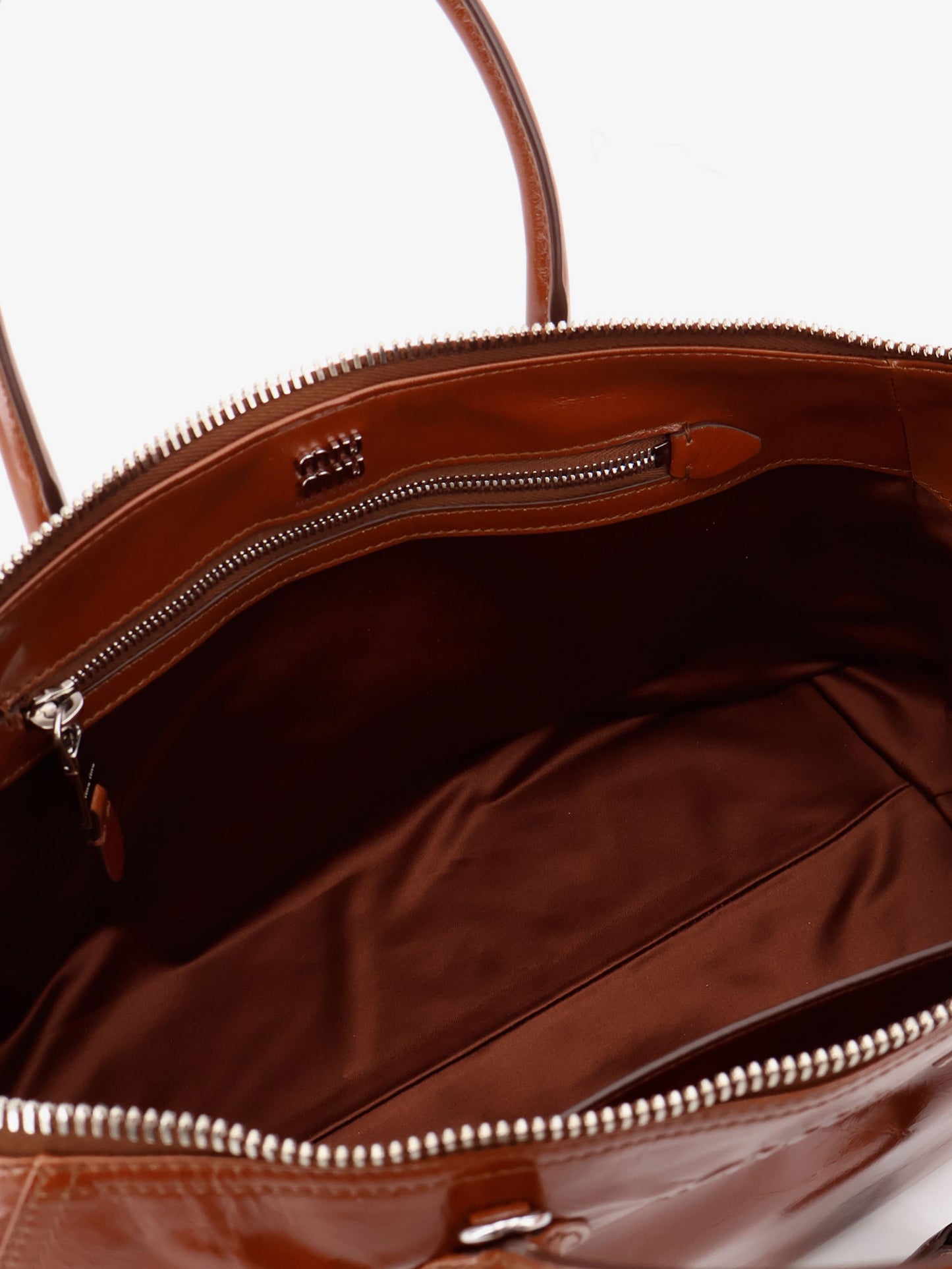 Shiny leather handbag with front lettering logo